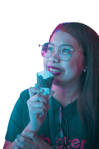 woman licking ice cream and smiling